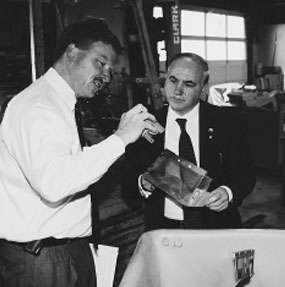 Peter Bennison of Waste Management and Recycling Products explains the elements of his computer reuse and recycling firm to Commission Chair Colton during a recent site visit.