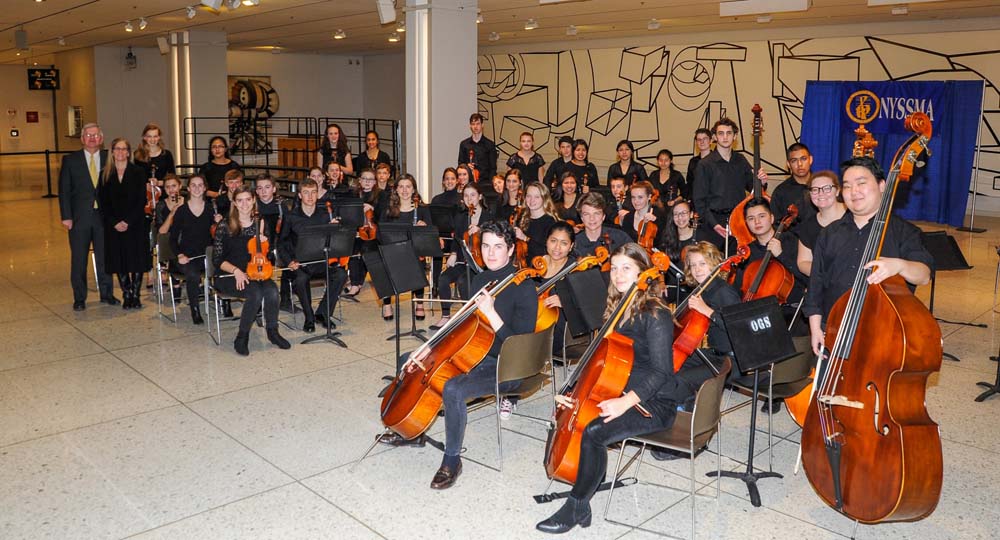 Assemblyman Fred W. Thiele Jr. pictured with students from the Southampton String Orchestra who performed on Wednesday, March 16, 2016 on the South Concourse of the Empire State Plaza in Albany in cel