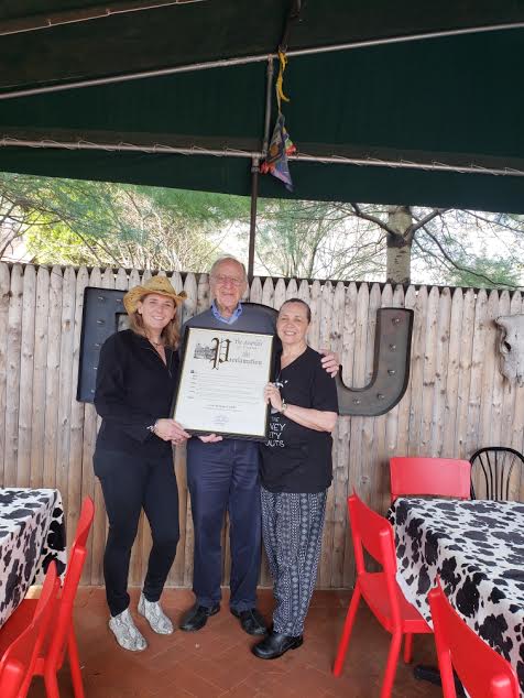 Assemblyman Dave McDonough [pictured center] with R.S. Jones owners Carole and Margaret Mueller on Saturday, April 13