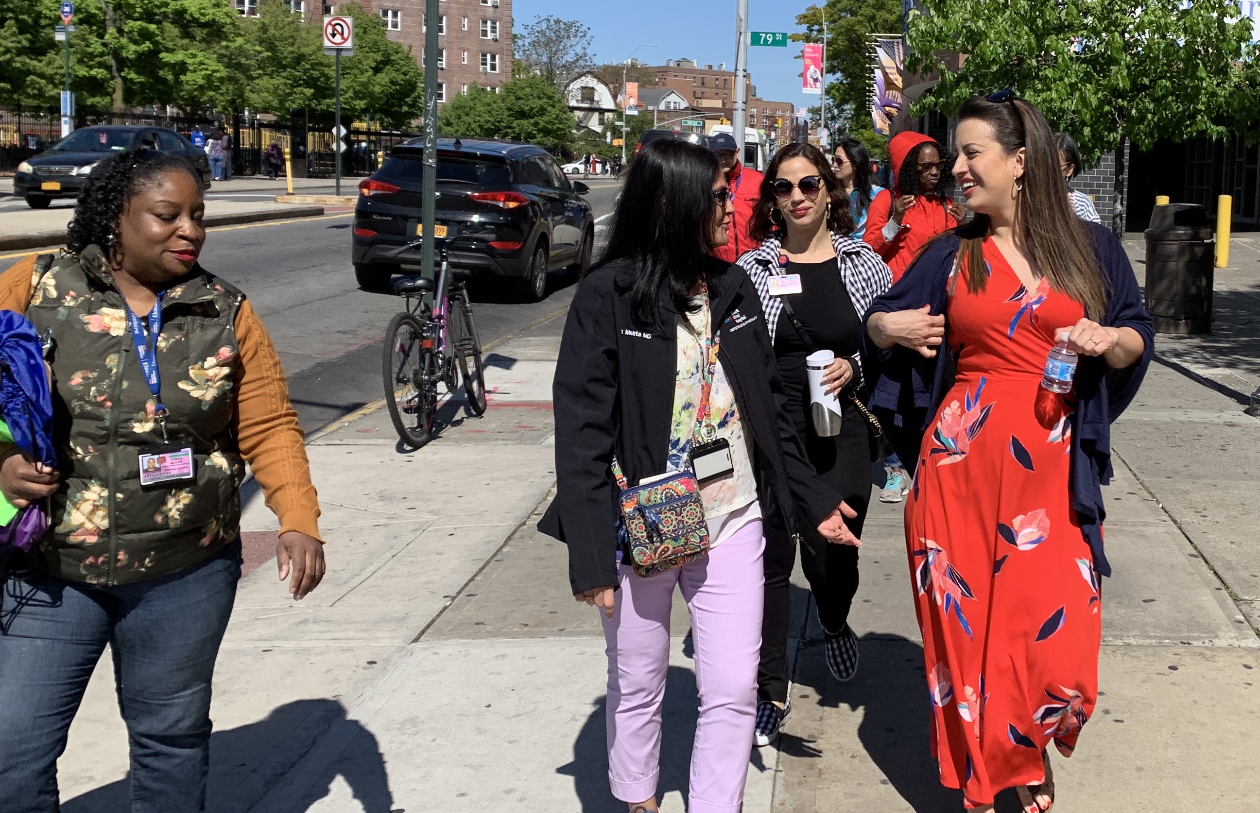 Assemblywoman Cruz walks with a Doctor from Elmhurst Hospital.