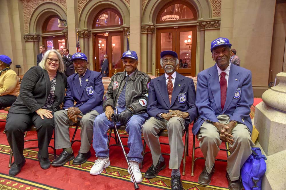Assemblywoman Weinstein posed with the Tuskegee Airmen, the all-black Air Force squadrons, who served with distinction during World War II and helped lay the groundwork for the Civil Rights Movement o