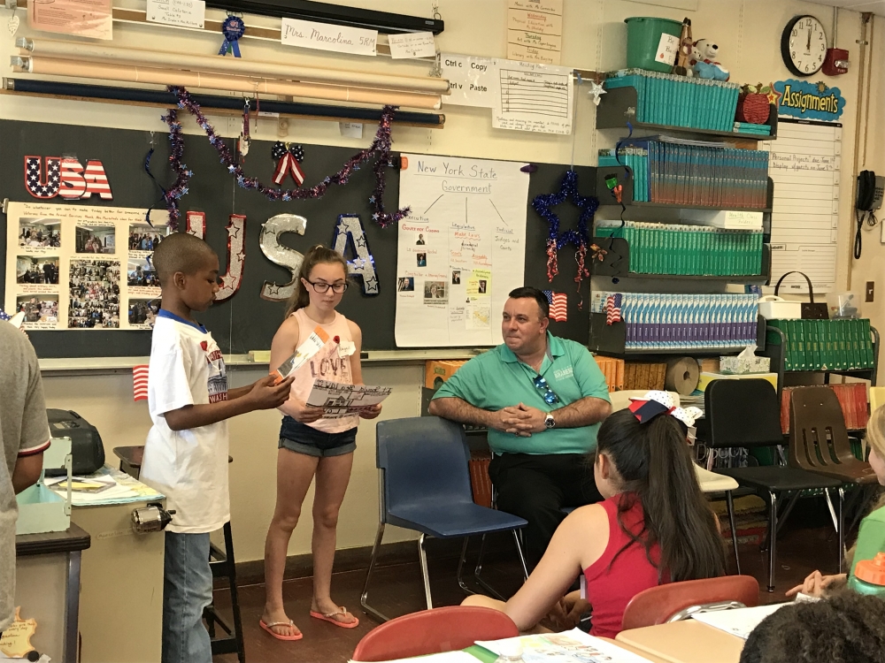 Assemblyman Karl Brabenec [front] listens to public policy ideas from students at Minisink Valley Intermediate School Friday