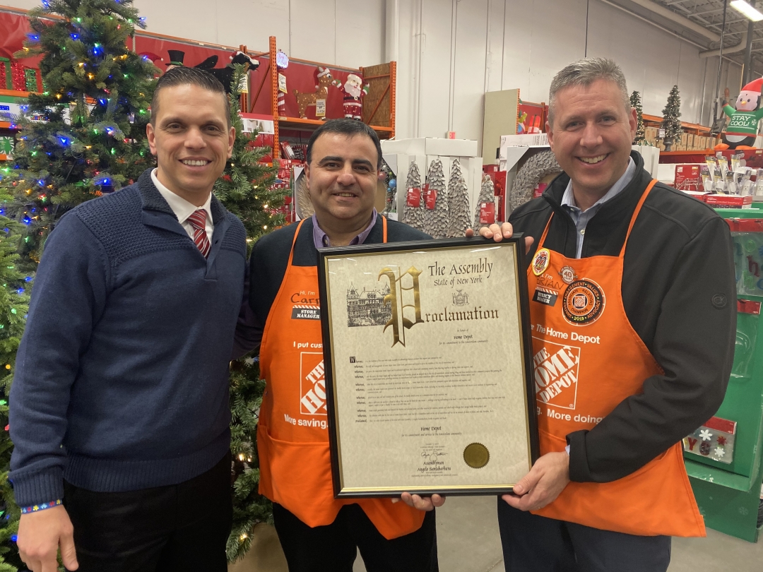 Assemblyman Santabarbara presents Home Depot (Amsterdam) store manager, Carm Carbone, Home Depot Albany District Manager Brian Kinney a New York State Assembly proclamation recognizing their support o