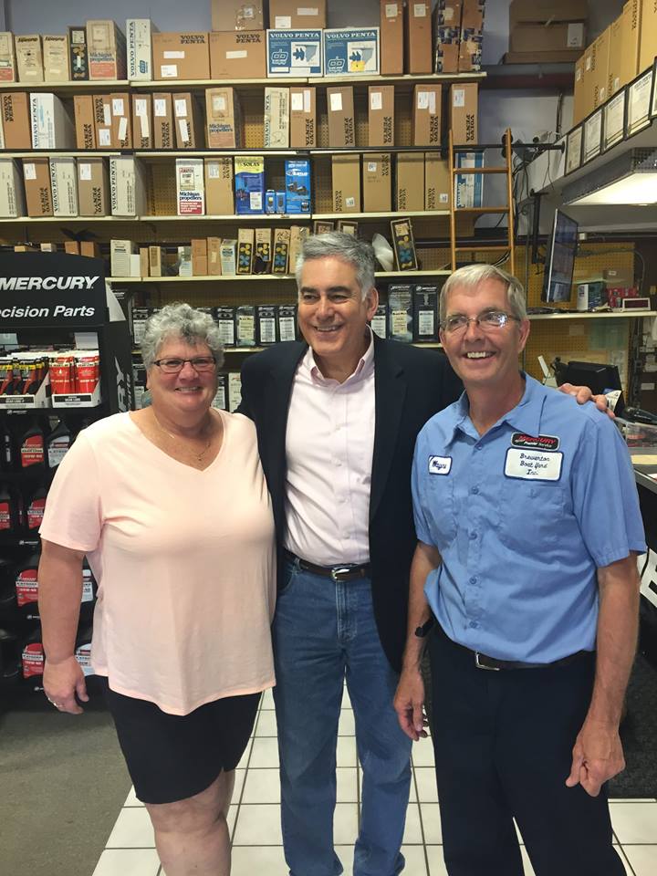 Assemblyman Stirpe talks with Wayne and Helen Carroll of Brewerton Boatyard, Inc.