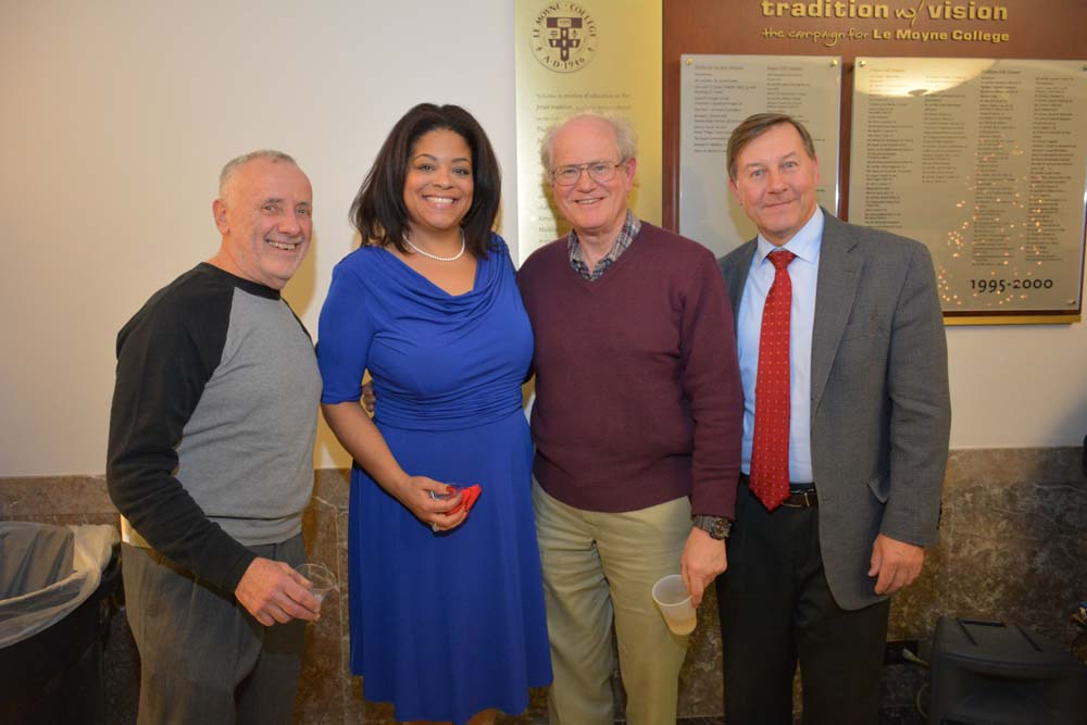 Bruce Block, Bill Delavan, President of the Delavan Center & Steve Kulick, Director of Corporate, Foundation and Government Relations at Le Moyne College congratulate Assemblymember Pamela J. Hunter a