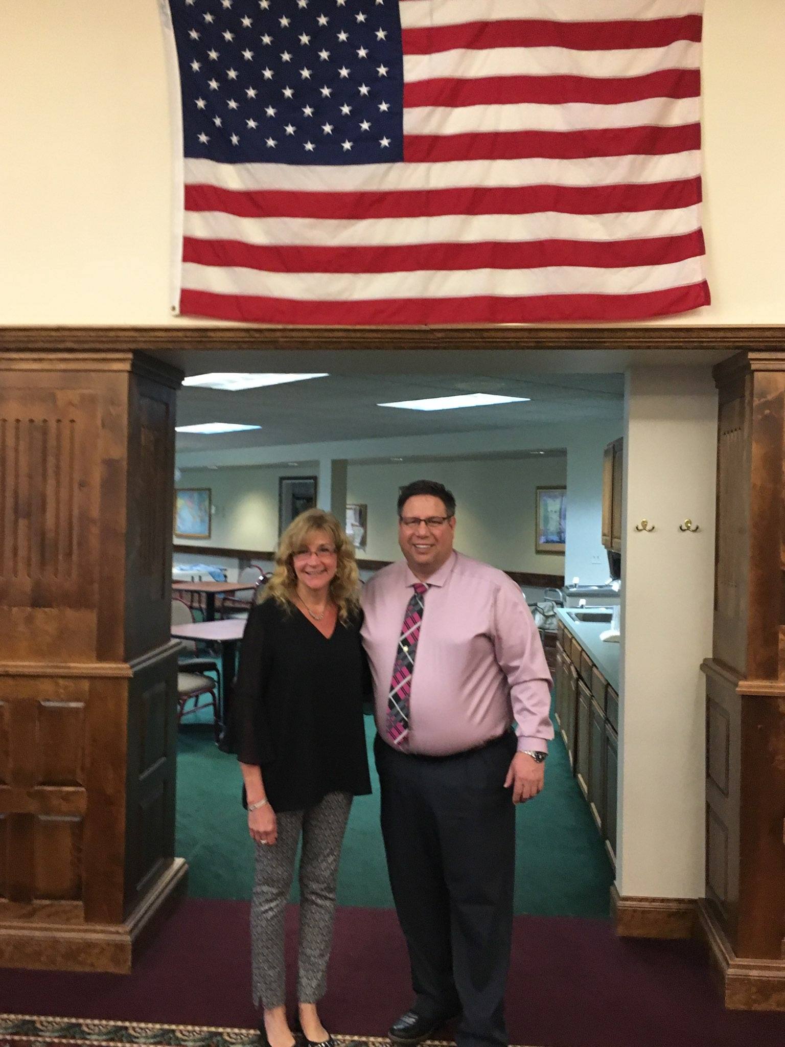 Assemblyman Brian Manktelow (R,C,I,Ref-Lyons)  and Cheryl Sylvestri, administrator of Bluefield Manor in Aurelius, an assisted living facility for seniors.