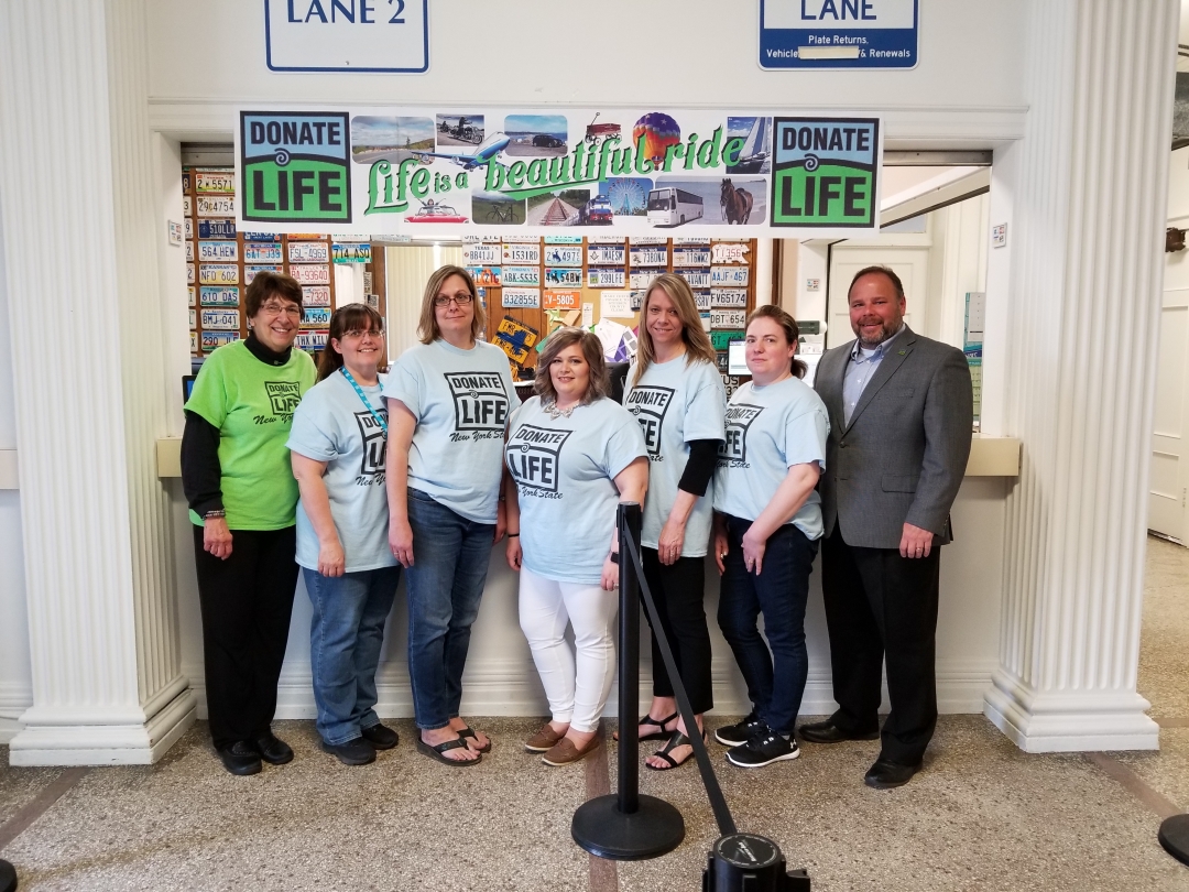 Palmesano, Hunter and Cranmer with Corning DMV employees sporting Donate Life shirts.