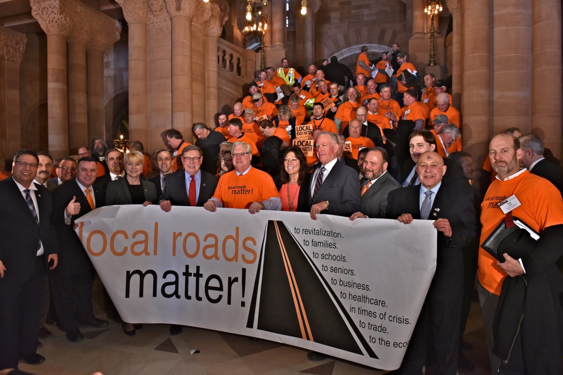 Assemblywoman Marjorie Byrnes (R,C-Caledonia) alongside highway workers on Wednesday, March 6.