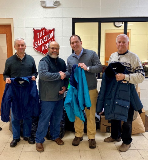 Assemblyman Mike Norris (second from right) drops off winter clothing items that were collected from the community as part of his annual drive. Standing with the assemblyman are Salvation Army Major J