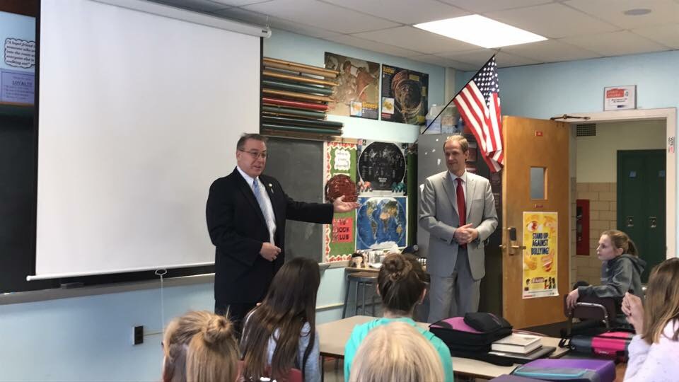 Assemblyman David DiPietro (R,C,I-East Aurora) and Sen. Patrick Gallivan explain their school supply bill to Mr. Minnuto's sixth grade class at Iroquois Middle School on December 21, 2017.