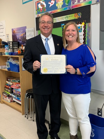 Assemblyman David DiPietro (R,C,I-East Aurora) presents the first teacher of the month award to Lisa Barron at Parkdale Elementary School in East Aurora on Friday, March 8.