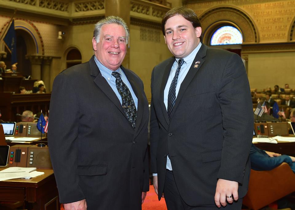 Assemblyman Doug Smith and Former Assemblyman Al Graf stand together for photo in the New York State Assembly Chambers