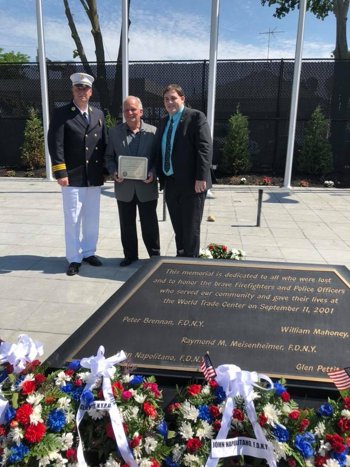 Assemblyman Smith applauds Islandia Mayor Al Dorman for newly constructed park and ballfields.