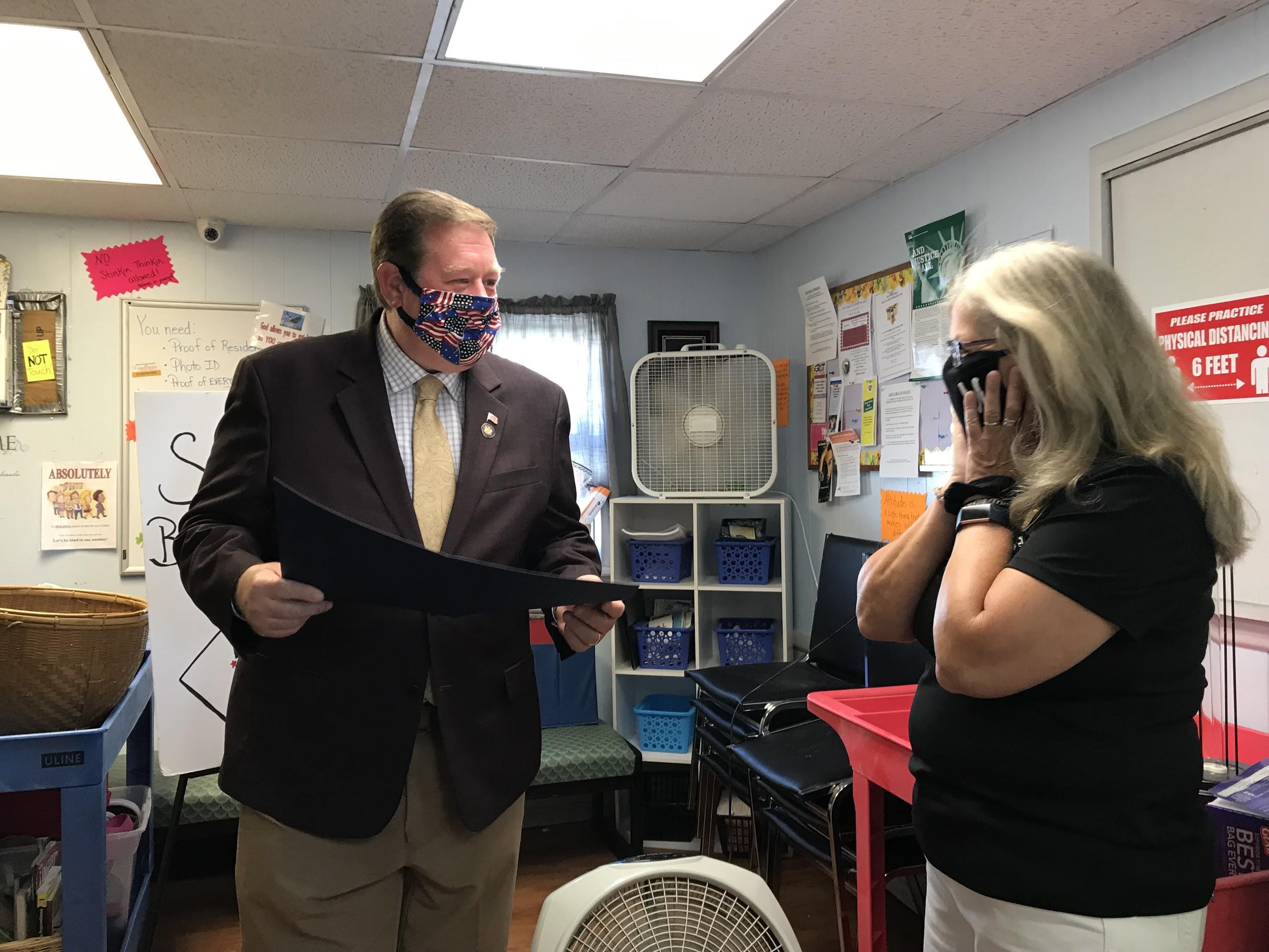 Assemblyman Chris Tague (R,C,I,Ref-Schoharie) presents Patti Dushane with legislative resolution on Wednesday, August 5th.