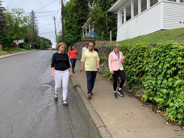 Pictured in the first photo with Speaker Heastie in Cortland (from left to right): REACH Project, Inc. Medical Director Dr. Justine Waldman and Assemblymember Anna Kelles.