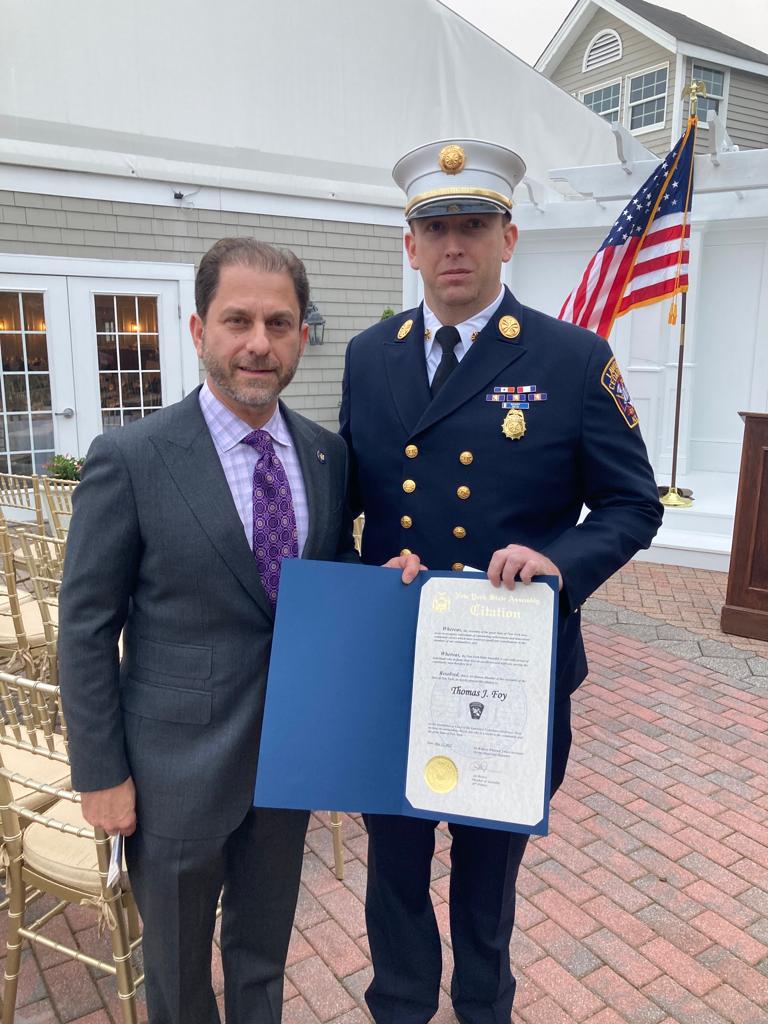 Assemblyman Ari Brown (R-Cedarhurst) (left) presents Lawrence-Cedarhurst Fire Department’s Chief Thomas J. Foy (Right) and with Assembly Citation Thursday, May 12.